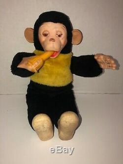 old stuffed monkey with banana